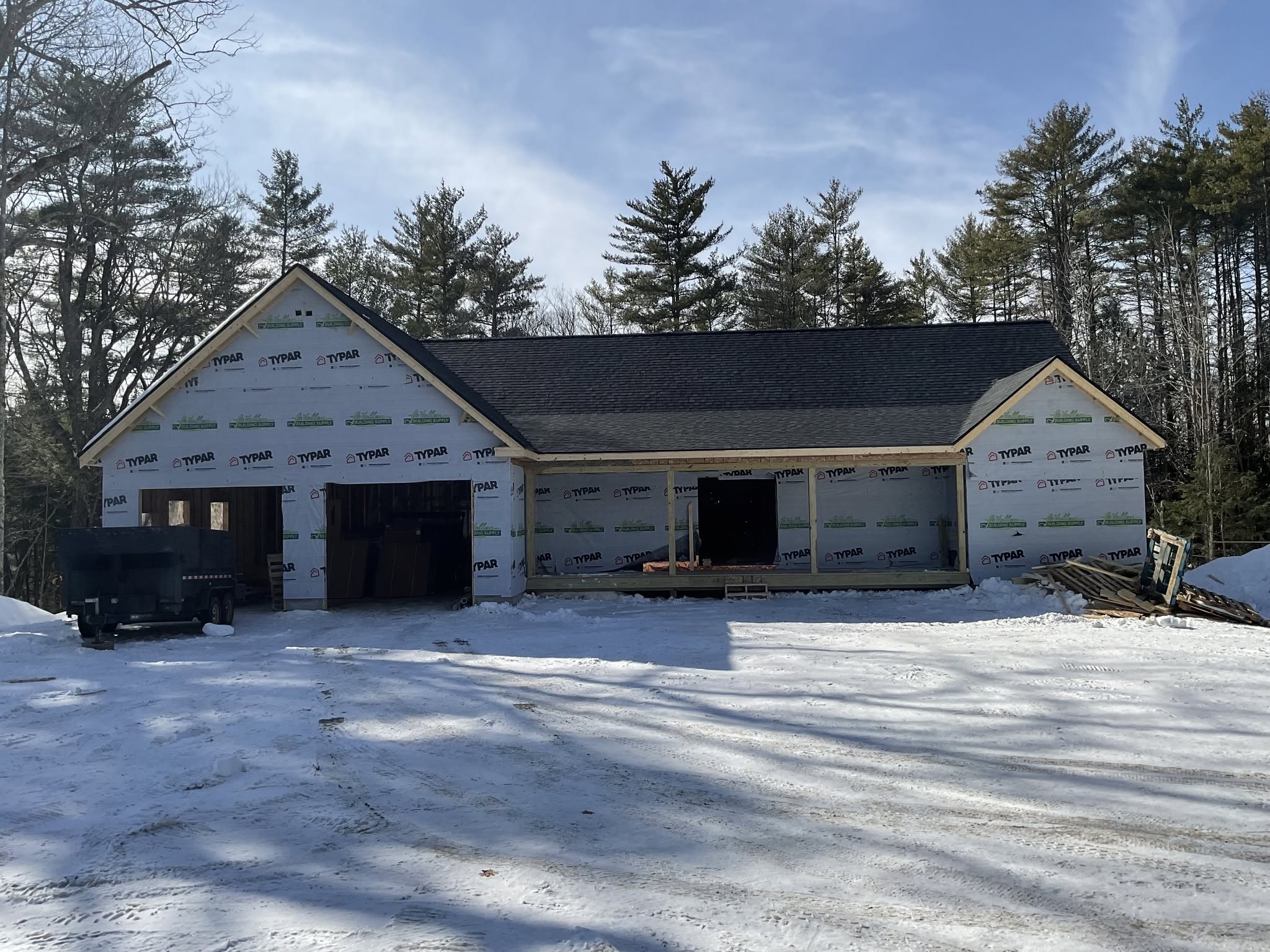 House exterior under construction in winter, posted by Three Lakes Builders LLC
