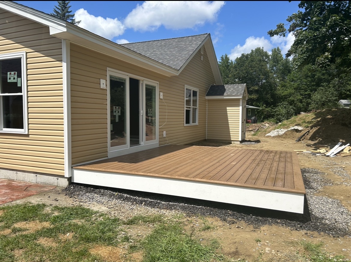 New ground-level deck on a single-story home, by Three Lakes Builders LLC
