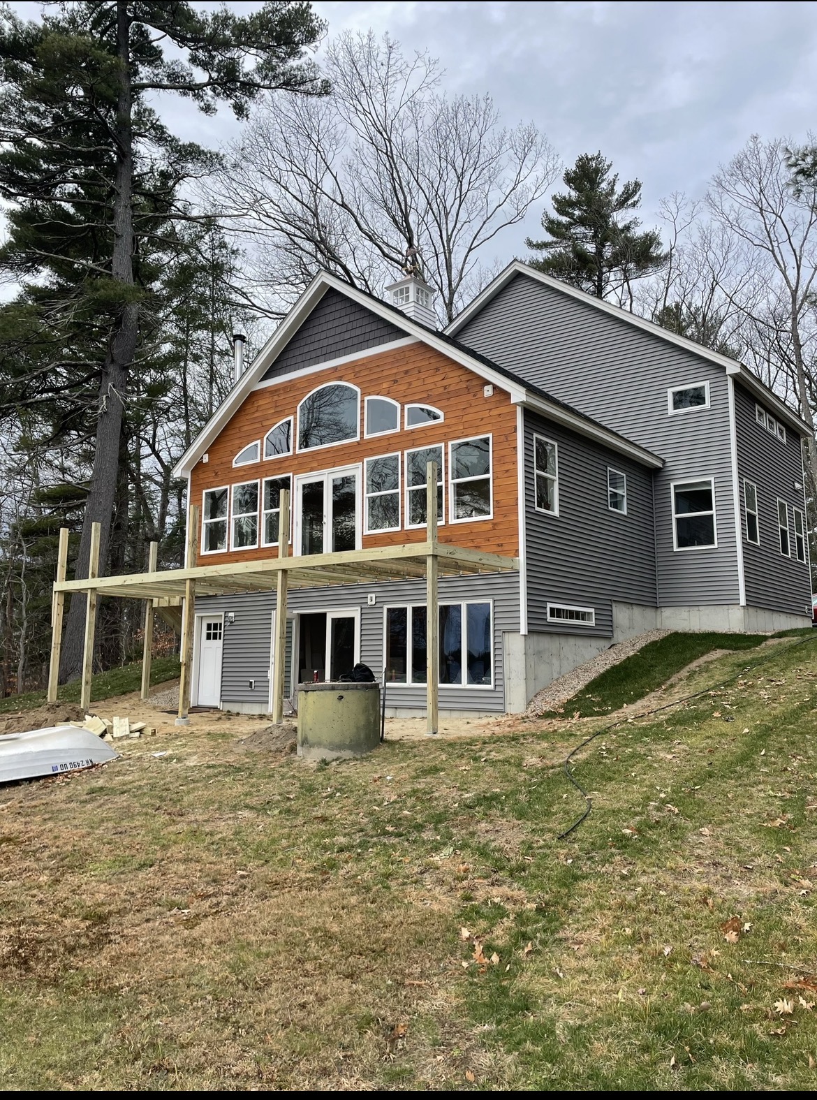 New two-story home with covered porch nearing completion, by Three Lakes Builders LLC
