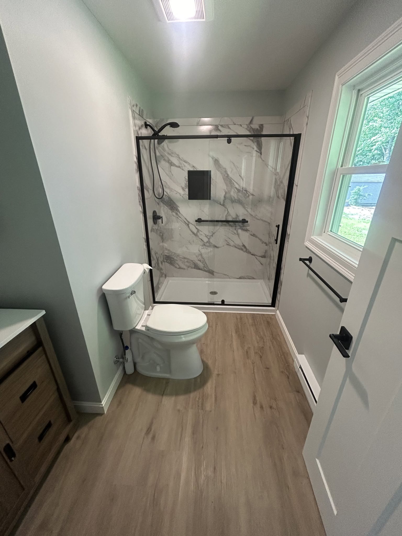 Bathroom with glass shower enclosure, posted by Three Lakes Builders LLC