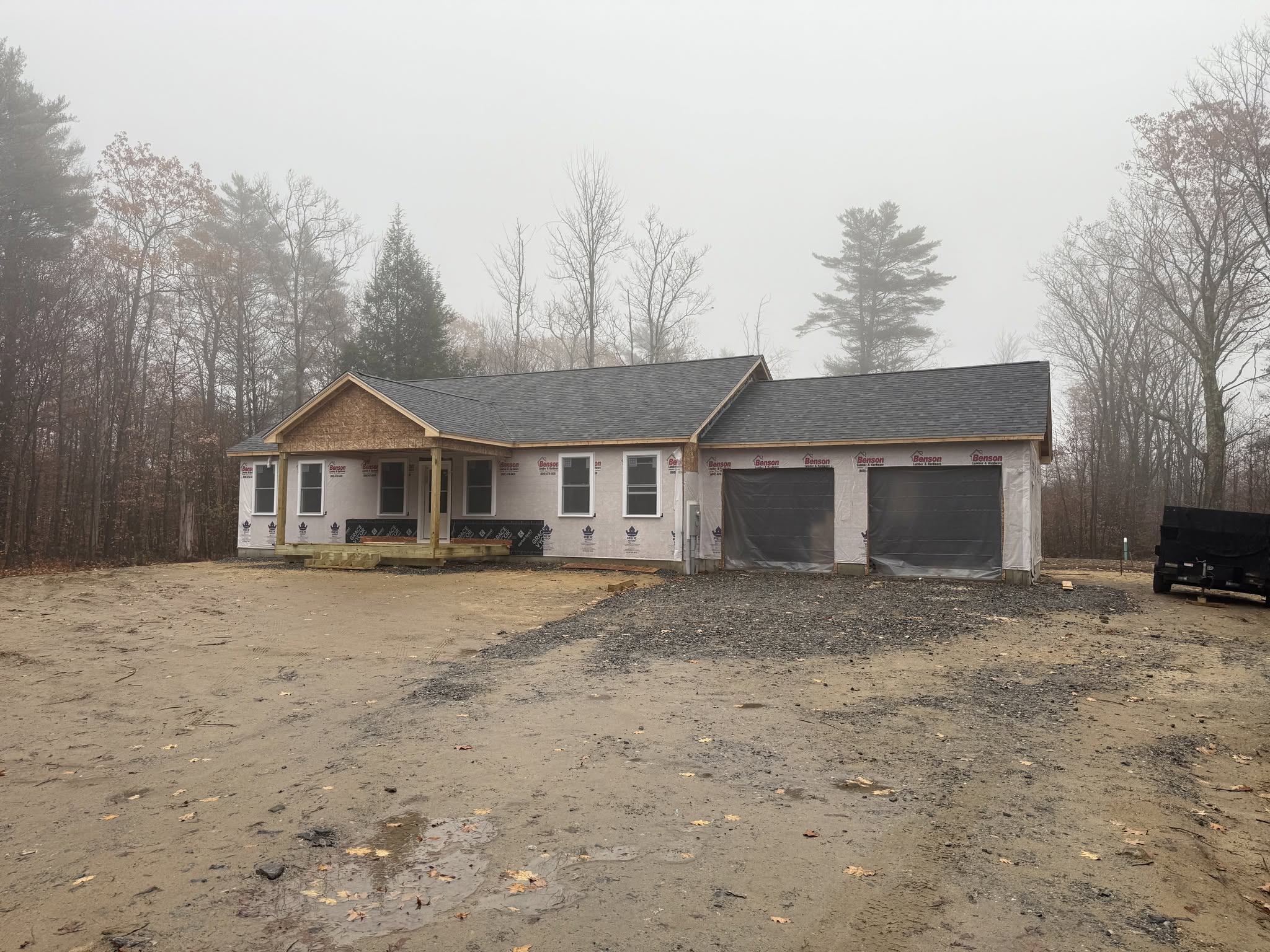 Single-story home with covered entry and attached garage, posted by Three Lakes Builders LLC